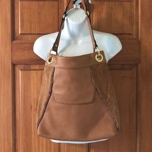 Leather bucket style shoulder bag.